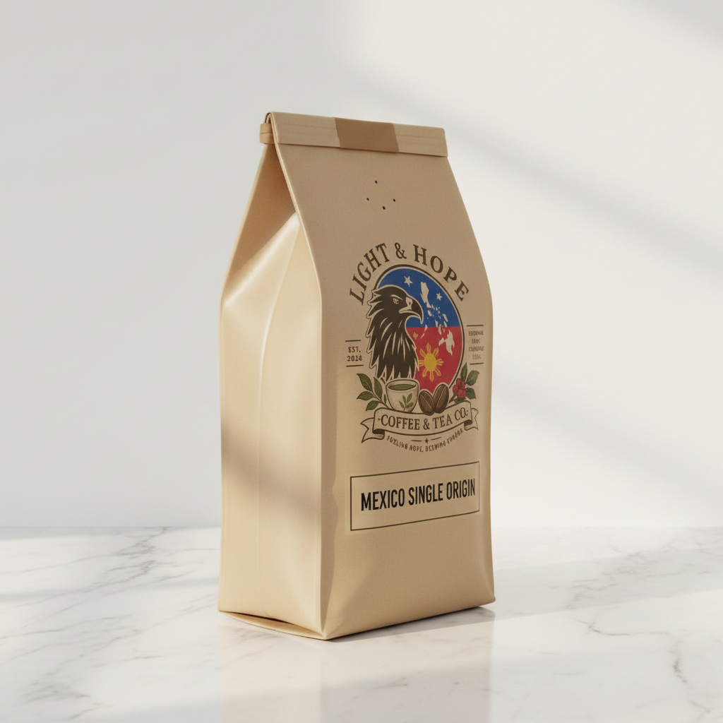 Light & Hope Coffee & Tea Co. Mexico single origin coffee bag side angle on white marble, soft warm natural light, minimalist premium product photography